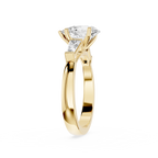 Gold ring with a diamond on a white background
