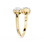 Gold ring with two diamonds on a white background