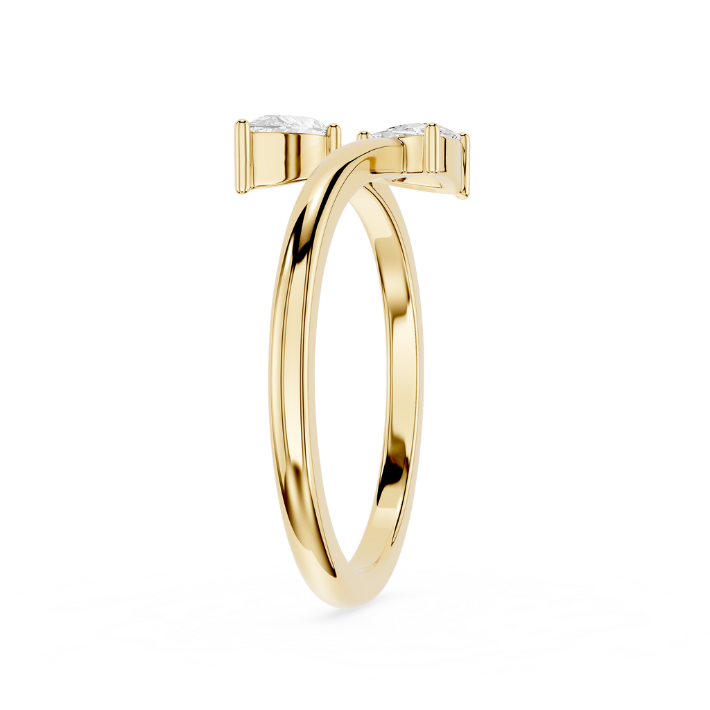 A polished yellow gold ring with a double-band design and two small clear gemstones at the top, shown on a plain white background.