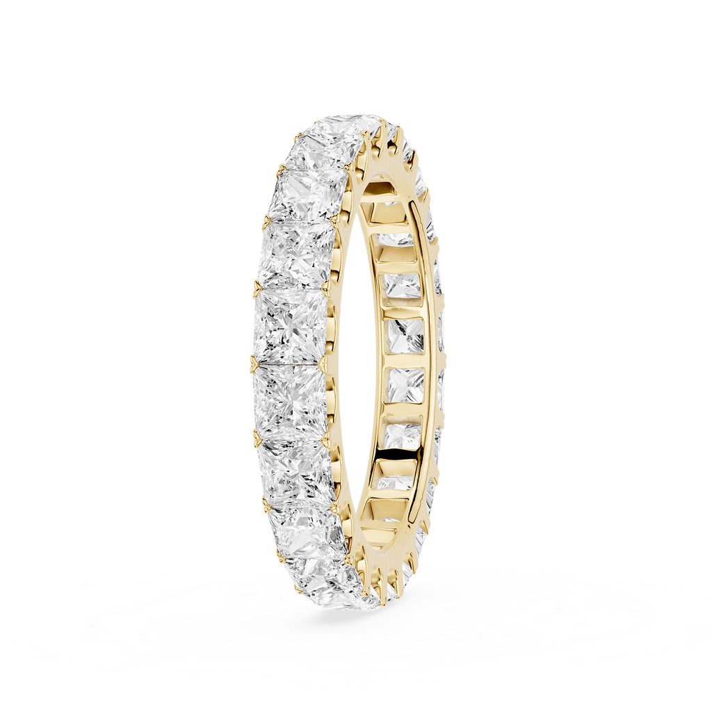 A yellow gold eternity ring paved with square-cut clear diamonds, shown on a clean white background.