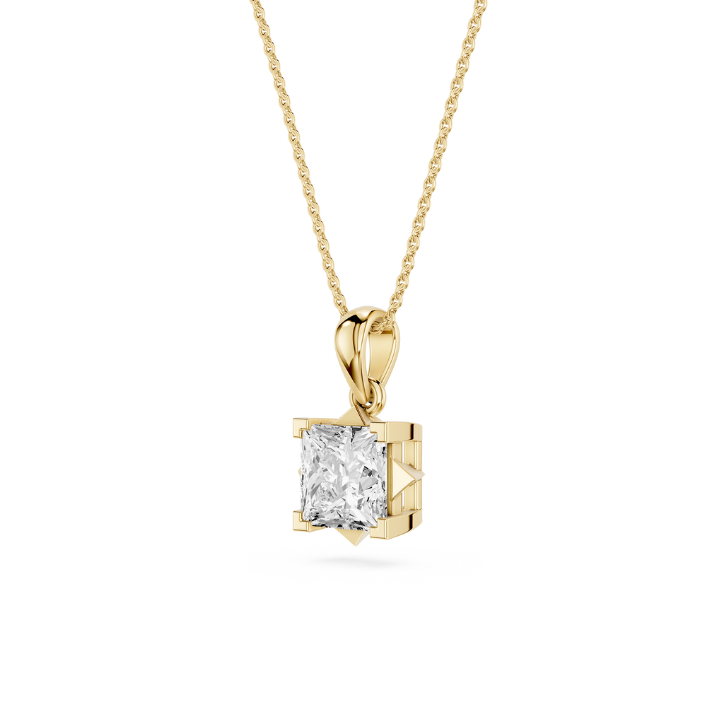 Gold pendant with a diamond on a white background