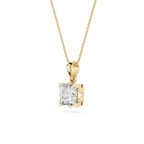 Gold pendant with a diamond on a white background