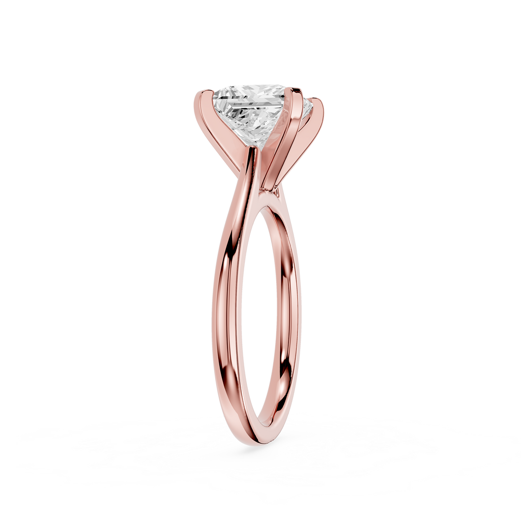 Rose gold ring with a diamond on a white background