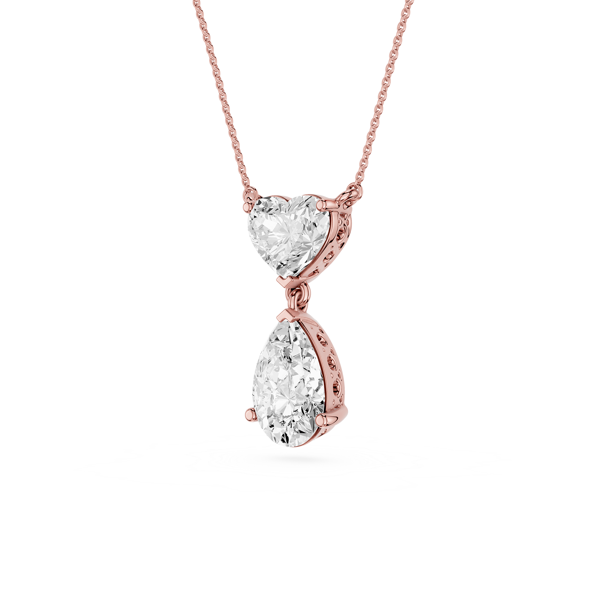 Rose gold necklace with heart and teardrop diamond pendants on a white background