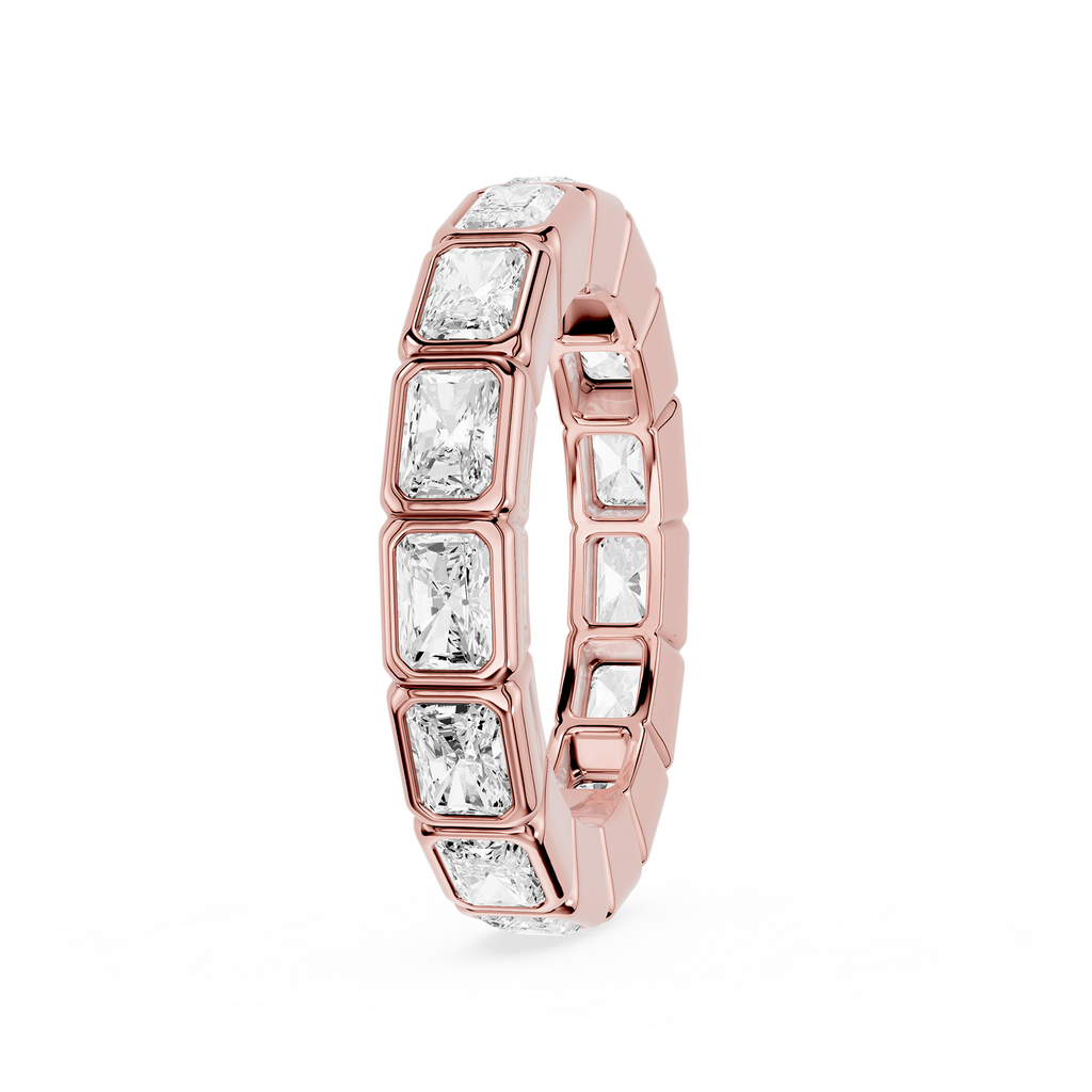 A Rose gold eternity ring featuring a continuous row of baguette-cut clear gemstones in a bezel setting, shown on a plain white background.