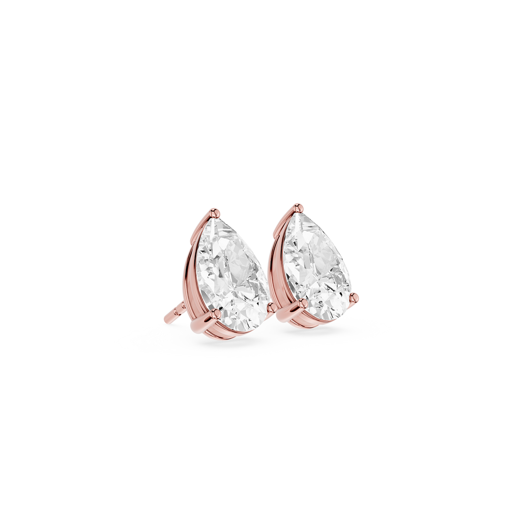 Rose gold earrings with clear teardrop-shaped gemstones on a white background