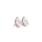Rose gold earrings with clear teardrop-shaped gemstones on a white background