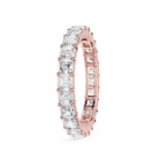 A rose gold eternity ring featuring a continuous row of clear baguette-cut gemstones, shown on a clean white background.