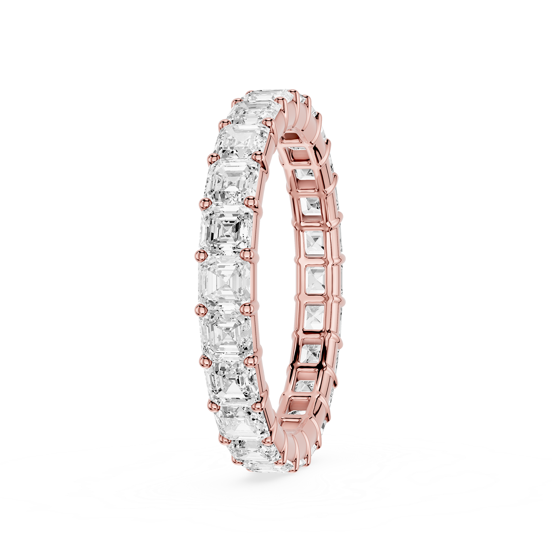 A rose gold eternity ring featuring a continuous row of clear baguette-cut gemstones, shown on a clean white background.