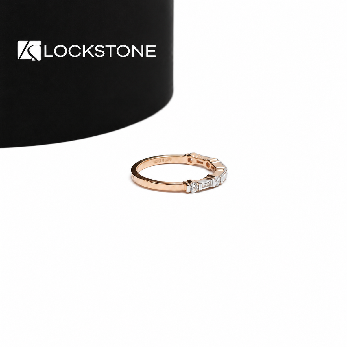 Mixed cut lab diamond band in rose gold showcasing baguette and round diamonds arranged across a polished ring