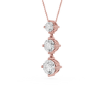 Rose gold necklace with three clear gemstones on a white background