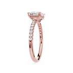 A rose gold engagement ring featuring a rectangular emerald-cut clear center stone and pavé-set round diamonds along the shank, shown on a clean white background.