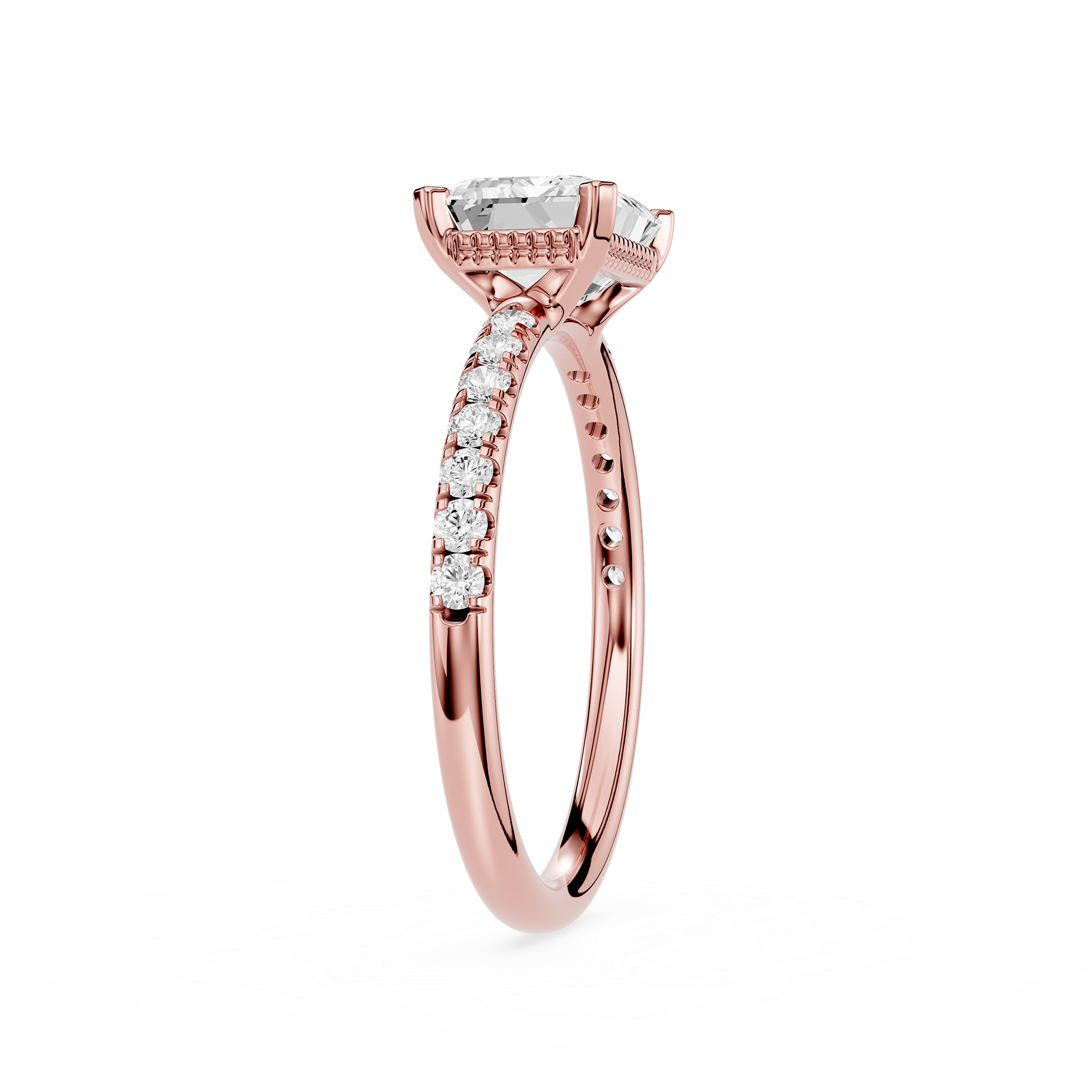 A rose gold engagement ring featuring a rectangular emerald-cut clear center stone and pavé-set round diamonds along the shank, shown on a clean white background.