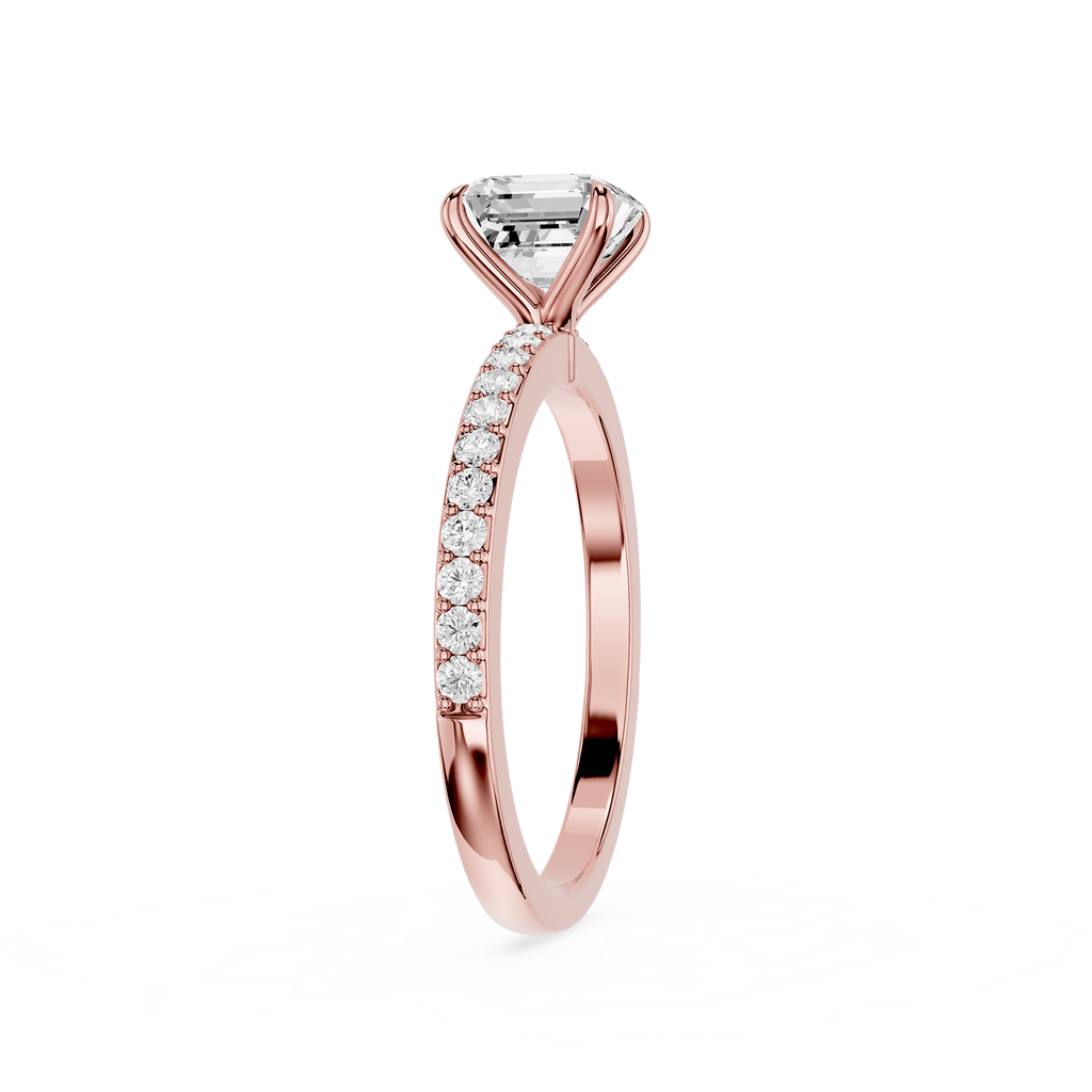 A rose gold engagement ring featuring a large round brilliant-cut center stone and a pavé band set with small round stones, shown on a plain white background.