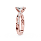 Rose gold ring with diamond accents on a white background