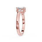 Rose gold ring with a diamond on a white background