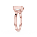Rose gold ring with a diamond on a white background