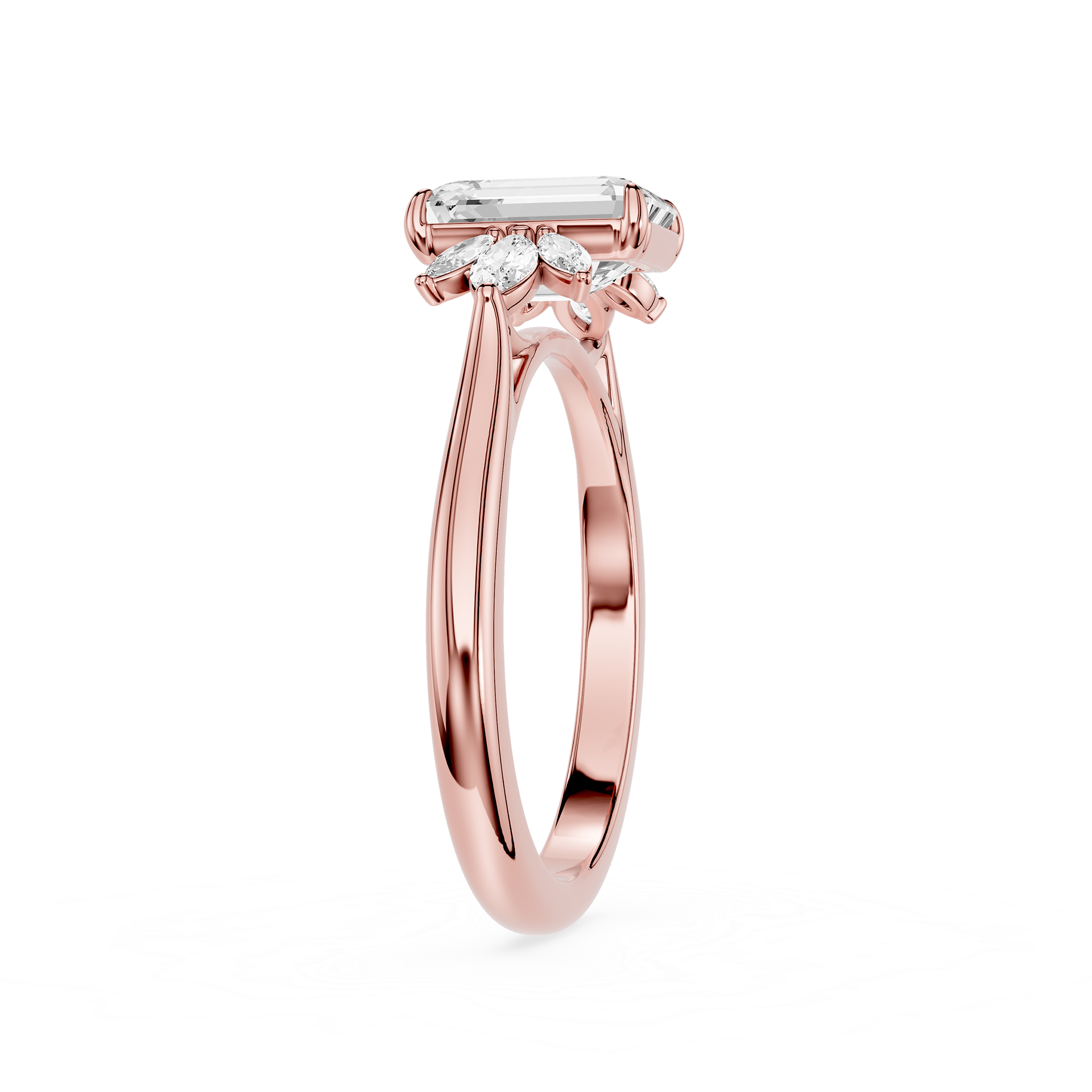 A rose gold engagement ring featuring an emerald-cut center stone and smaller marquise-cut side stones, shown on a clean white background.