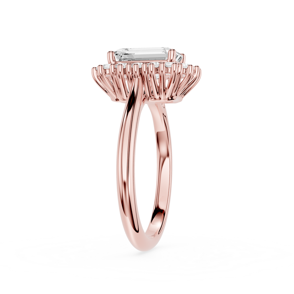 A rose gold halo ring featuring a rectangular baguette-cut clear gemstone, displayed on a clean white background.