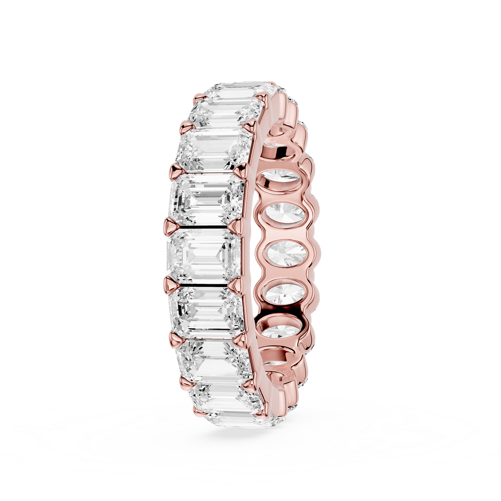 Silver ring with embedded diamonds on a white background