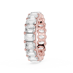 Silver ring with embedded diamonds on a white background