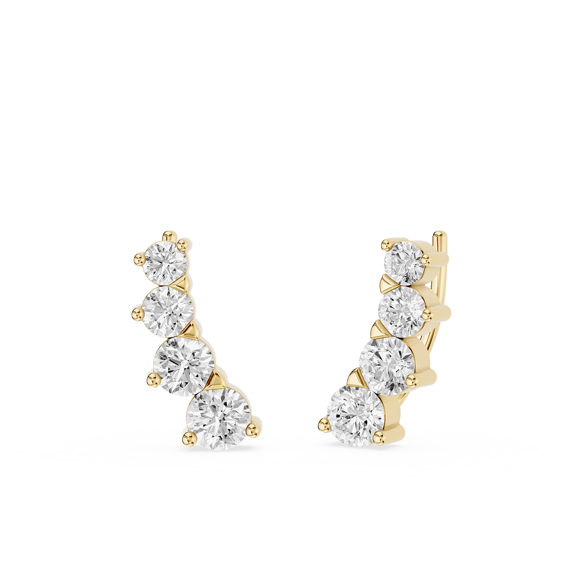 Gold and diamond earrings on a white background