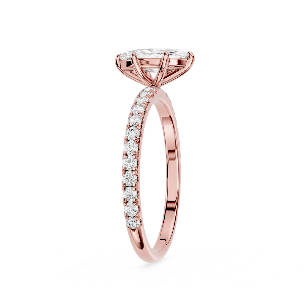 Rose gold diamond ring on a white background