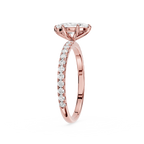 Rose gold diamond ring on a white background
