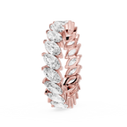 Rose gold and clear gemstone ring on a white background