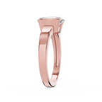 Rose gold ring with a diamond on a white background