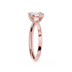 Rose gold ring with a diamond on a white background