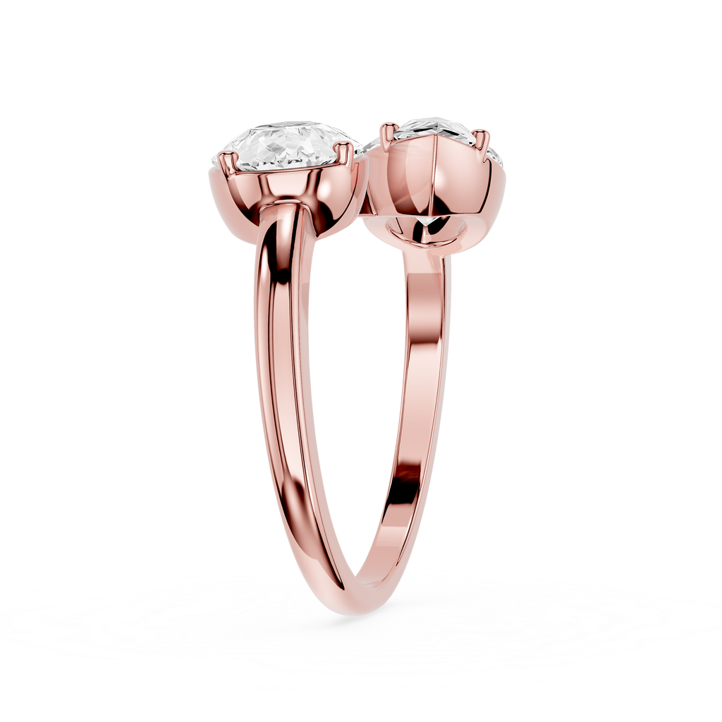 Rose gold ring with two diamonds on a white background