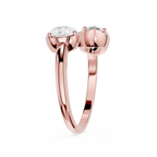 Rose gold ring with two diamonds on a white background