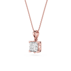 Rose gold pendant with a clear gemstone on a white background