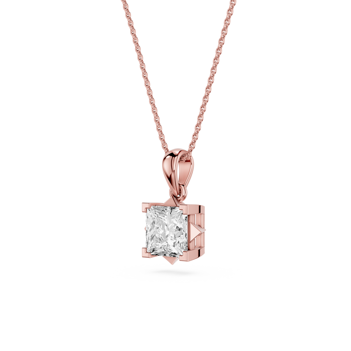 Rose gold pendant with a clear gemstone on a white background
