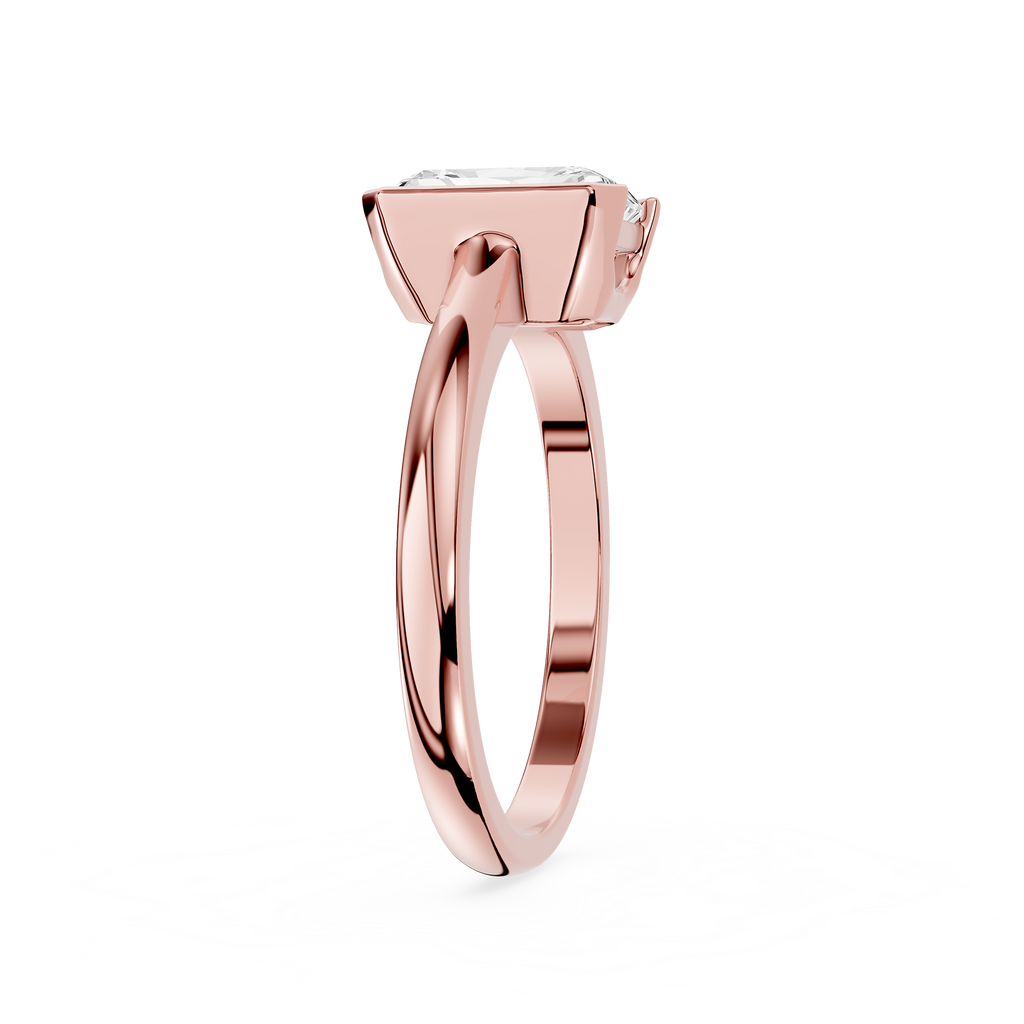 Rose gold ring with a diamond on a white background