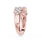 A rose gold engagement ring featuring a round cluster of clear diamonds, set in a polished split-shank band, shown against a solid white background.