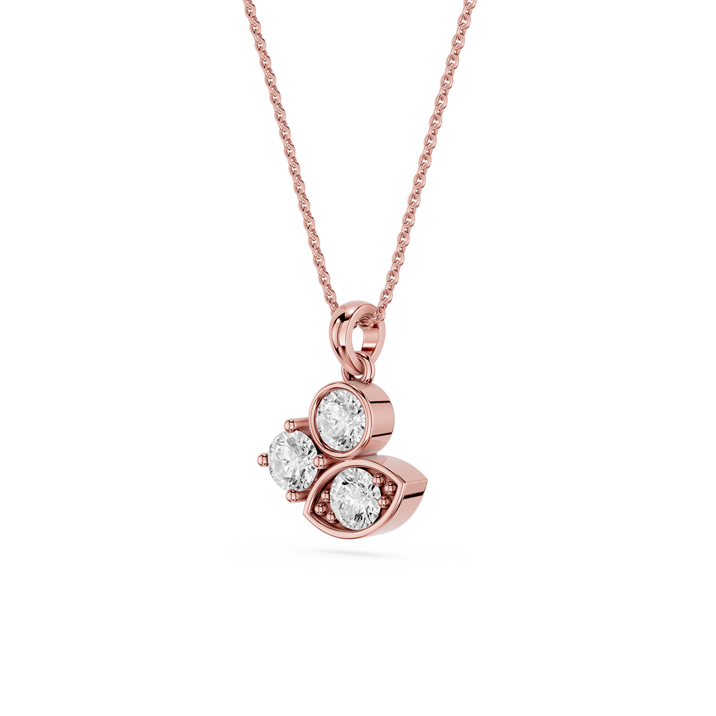 Rose gold necklace with a heart-shaped pendant featuring three diamonds on a white background