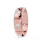Rose gold ring with embedded diamonds on a white background