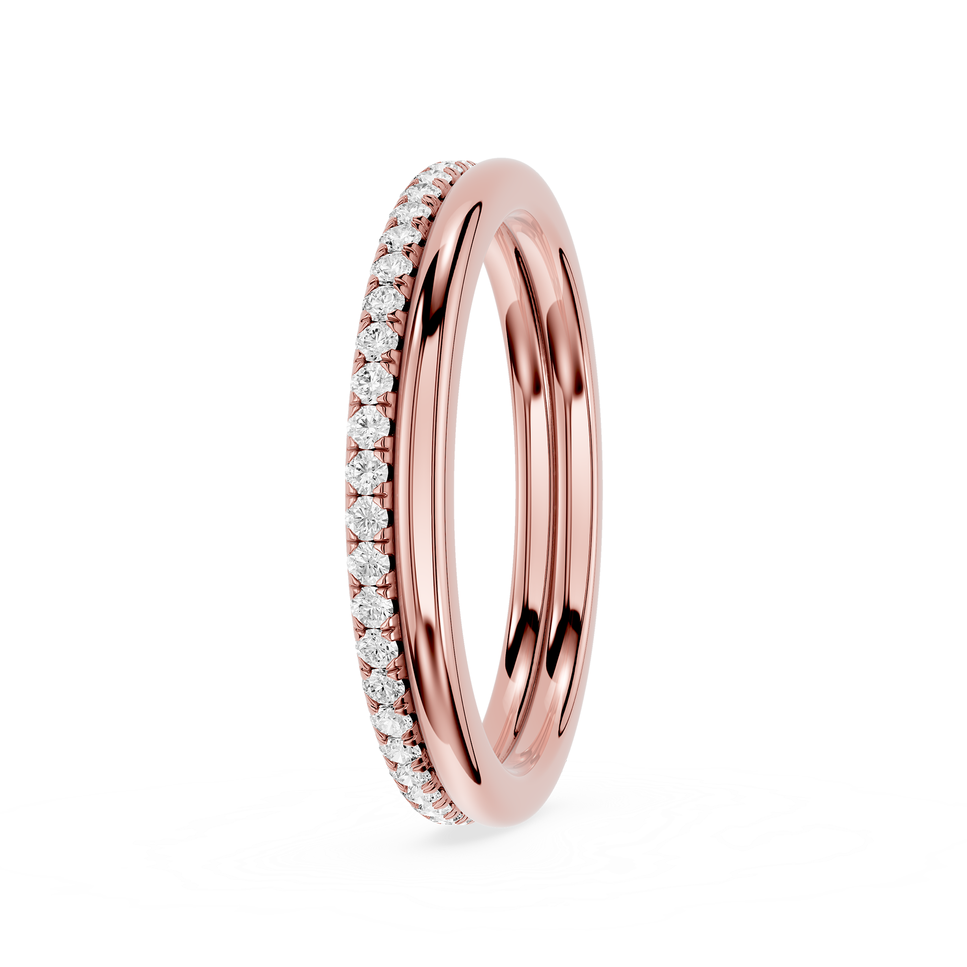 A rose gold eternity-style wedding band featuring a channel-set row of clear pavé diamonds on one side, shown on a clean white background.