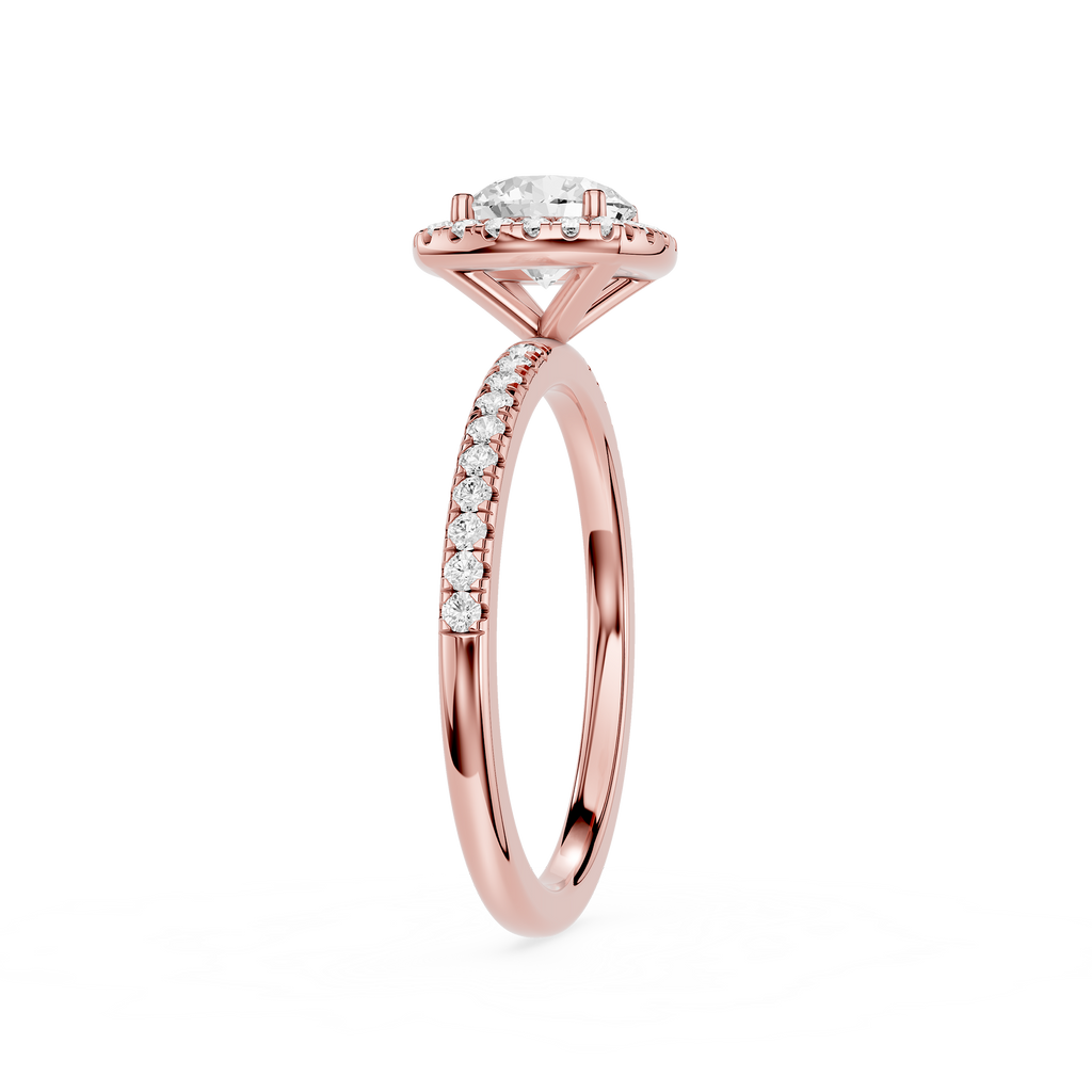 Rose gold ring with a diamond on a white background