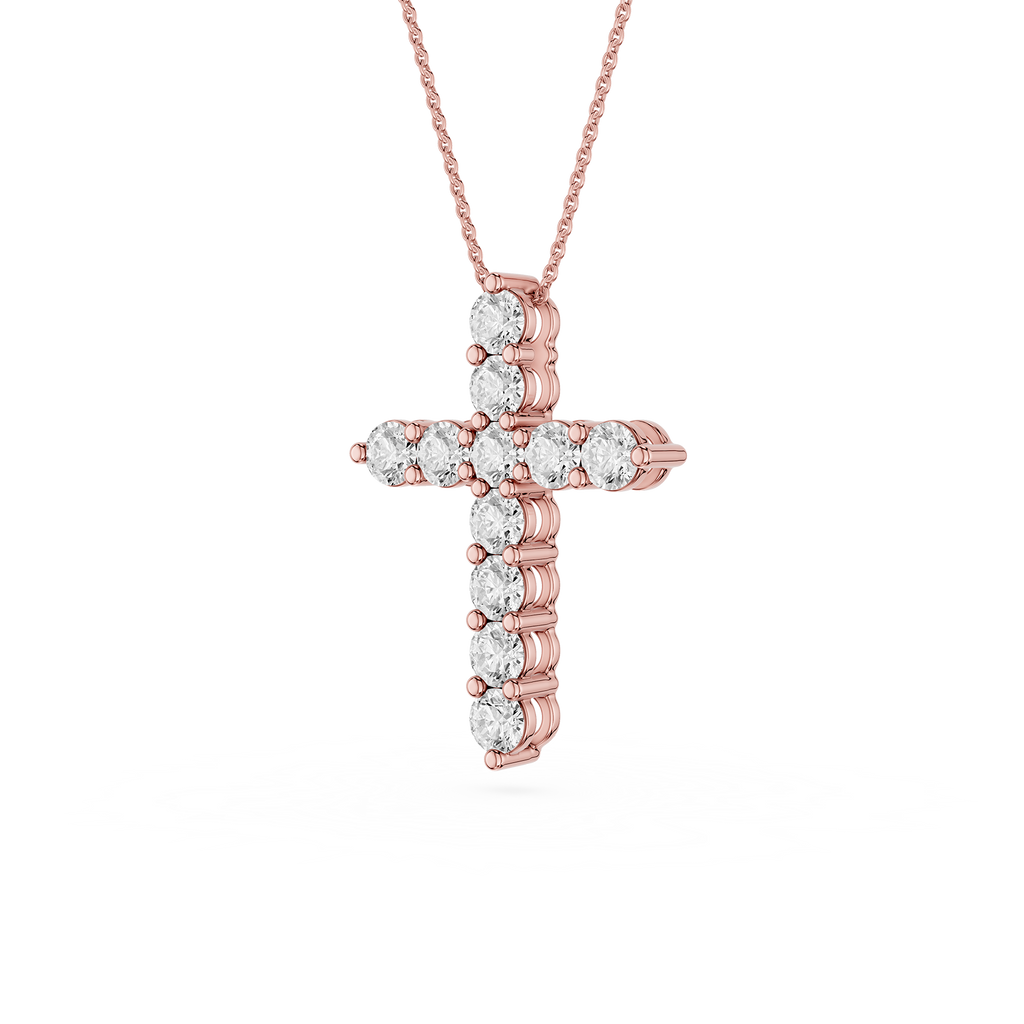 Rose gold cross pendant with diamonds on a white background