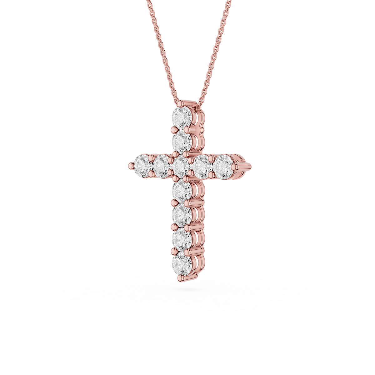 Rose gold cross pendant with diamonds on a white background