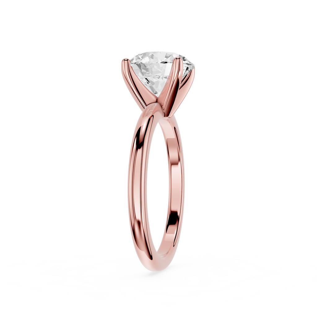 Rose gold ring with a diamond on a white background