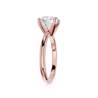Rose gold ring with a diamond on a white background