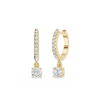 Gold hoop earrings with diamond accents on a white background