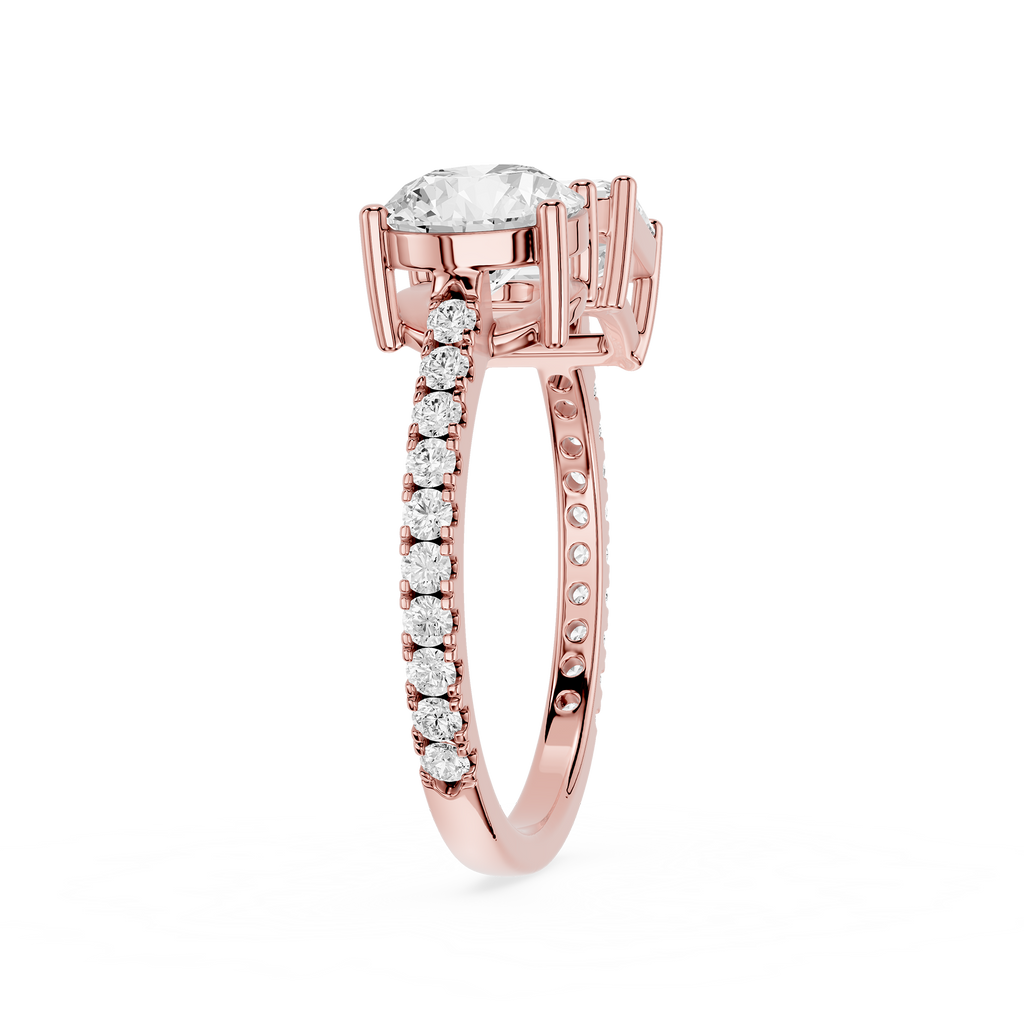 A yellow gold diamond ring with a large round-cut center stone and a pavé band set with small round diamonds, shown on a plain white background.