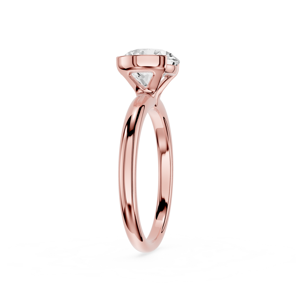Rose gold ring with a diamond on a white background
