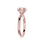 Rose gold ring with a diamond on a white background
