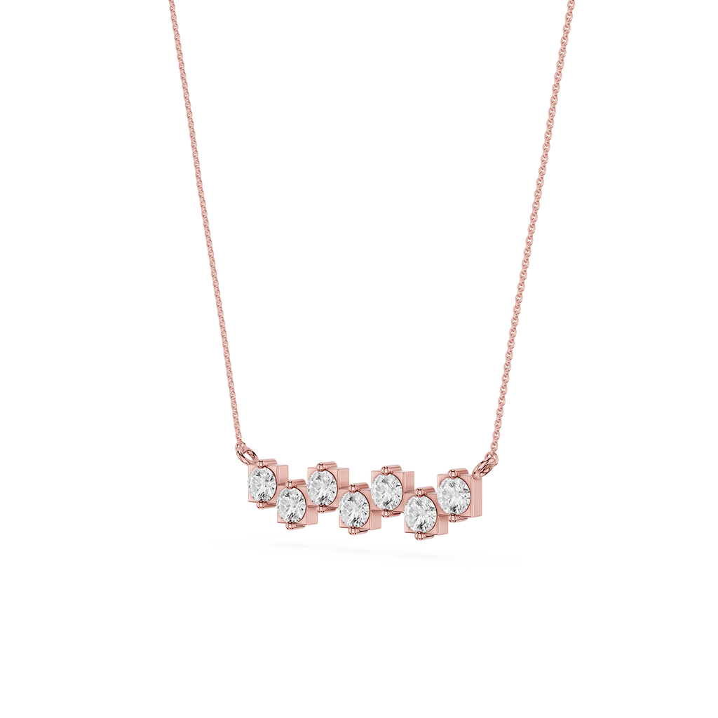 Rose gold necklace with clear gemstones on a white background